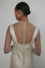 Rear view of ivory Violette Tulle Sheath showing extended button closure at center back. Architectural construction, handcrafted in California from 100% tulle.
