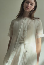 Model wearing the Alabaster silk organza Brise Skirt, showcasing its voluminous silhouette, sheer fabric, and elegant midi-length drape.
