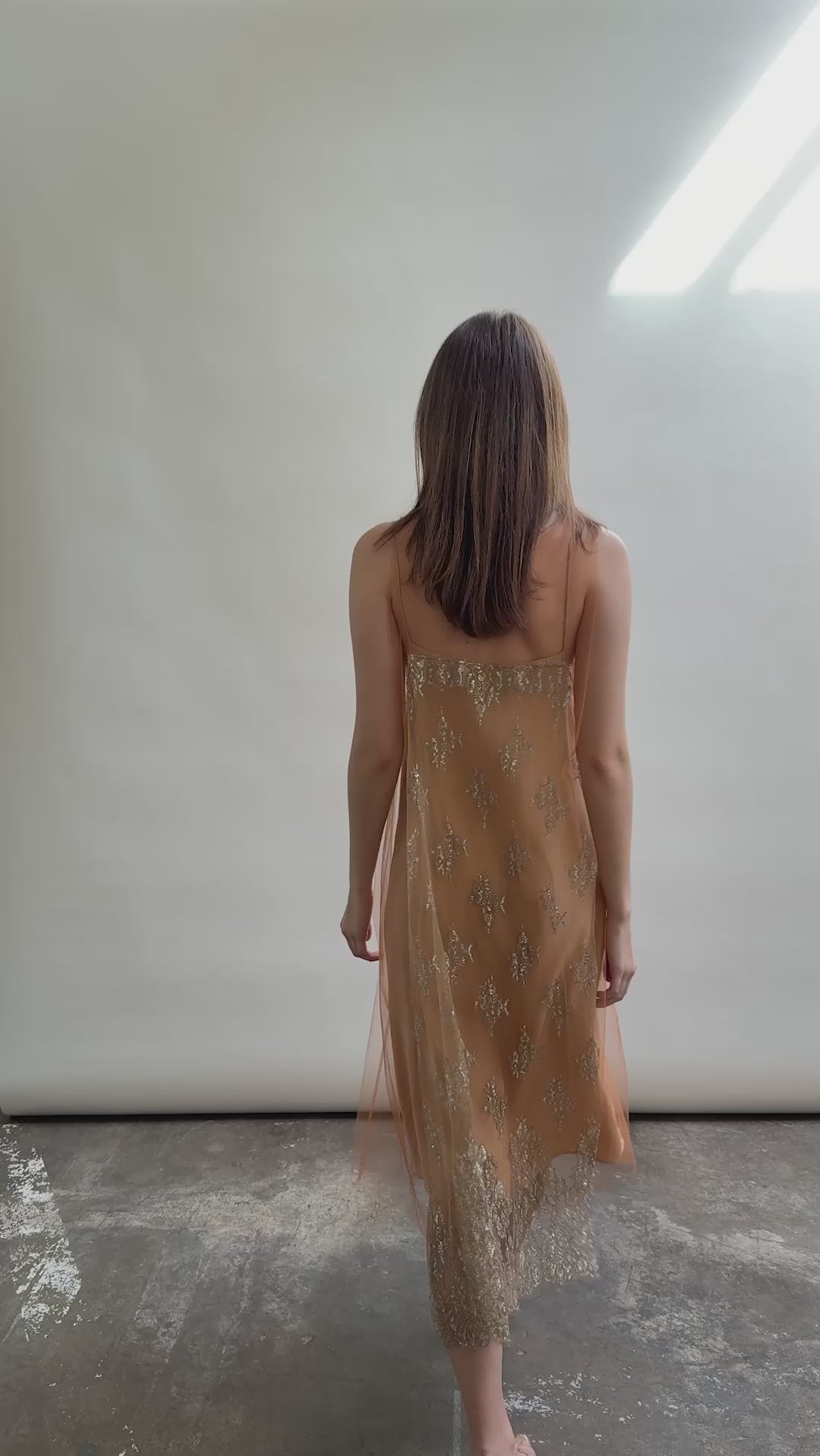 Kamperett Thistle Lace Shift in motion — delicate French lace tulle shifts with movement, persimmon A-line silhouette, effortless and modern minimalist elegance.