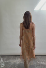 Kamperett Thistle Lace Shift in motion — delicate French lace tulle shifts with movement, persimmon A-line silhouette, effortless and modern minimalist elegance.