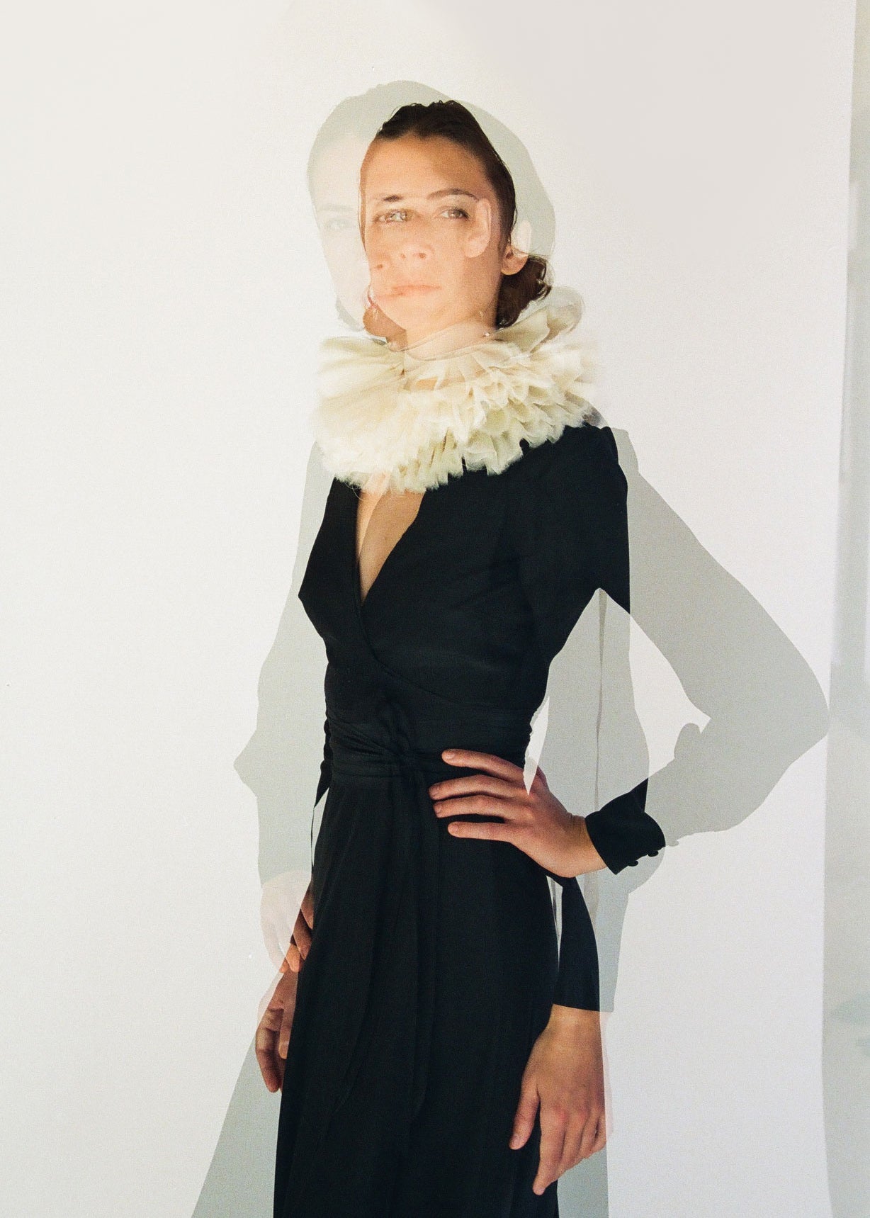 Detail of the collar styling on the black matte silk charmeuse Kamperett Adelaide Midi Dress.