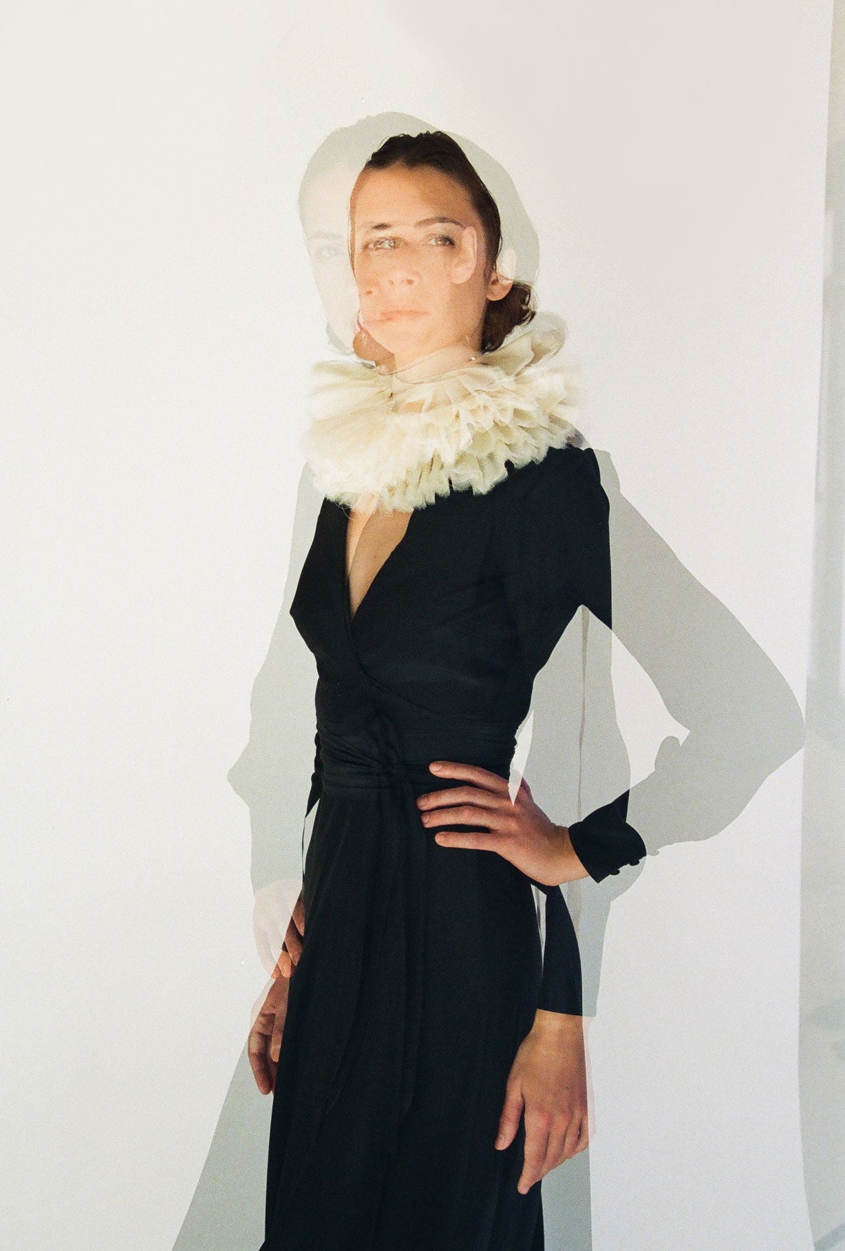 Detail of the collar styling on the black matte silk charmeuse Kamperett Adelaide Midi Dress.