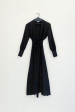 Editorial image of the black matte silk charmeuse Kamperett Adelaide Midi Dress.