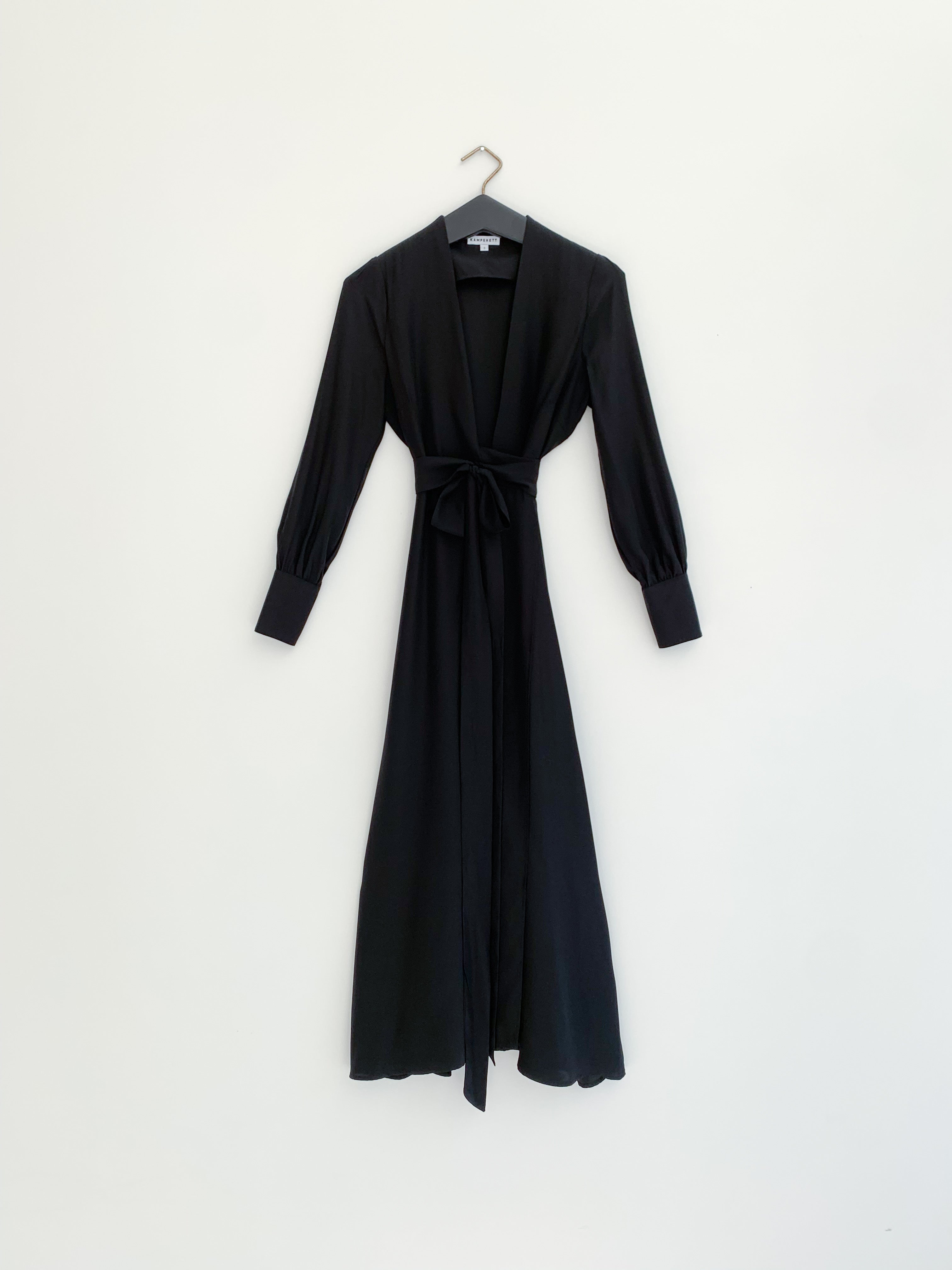 Editorial image of the black matte silk charmeuse Kamperett Adelaide Midi Dress.