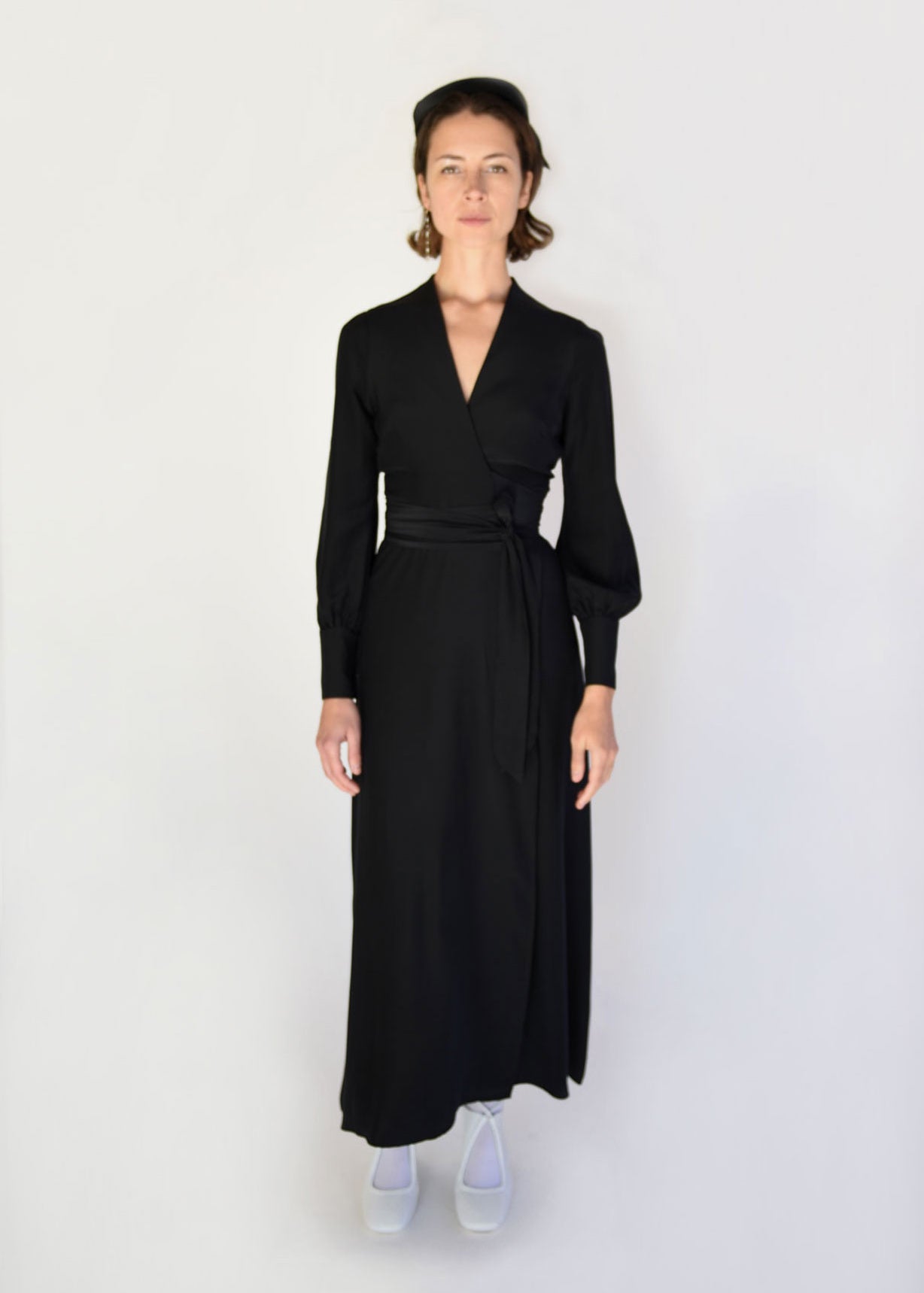 Side view of the black matte silk charmeuse Kamperett Adelaide Midi Dress.