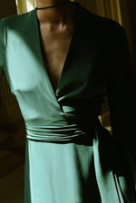 Back view of the dark green matte silk charmeuse Kamperett Adelaide Midi Dress.