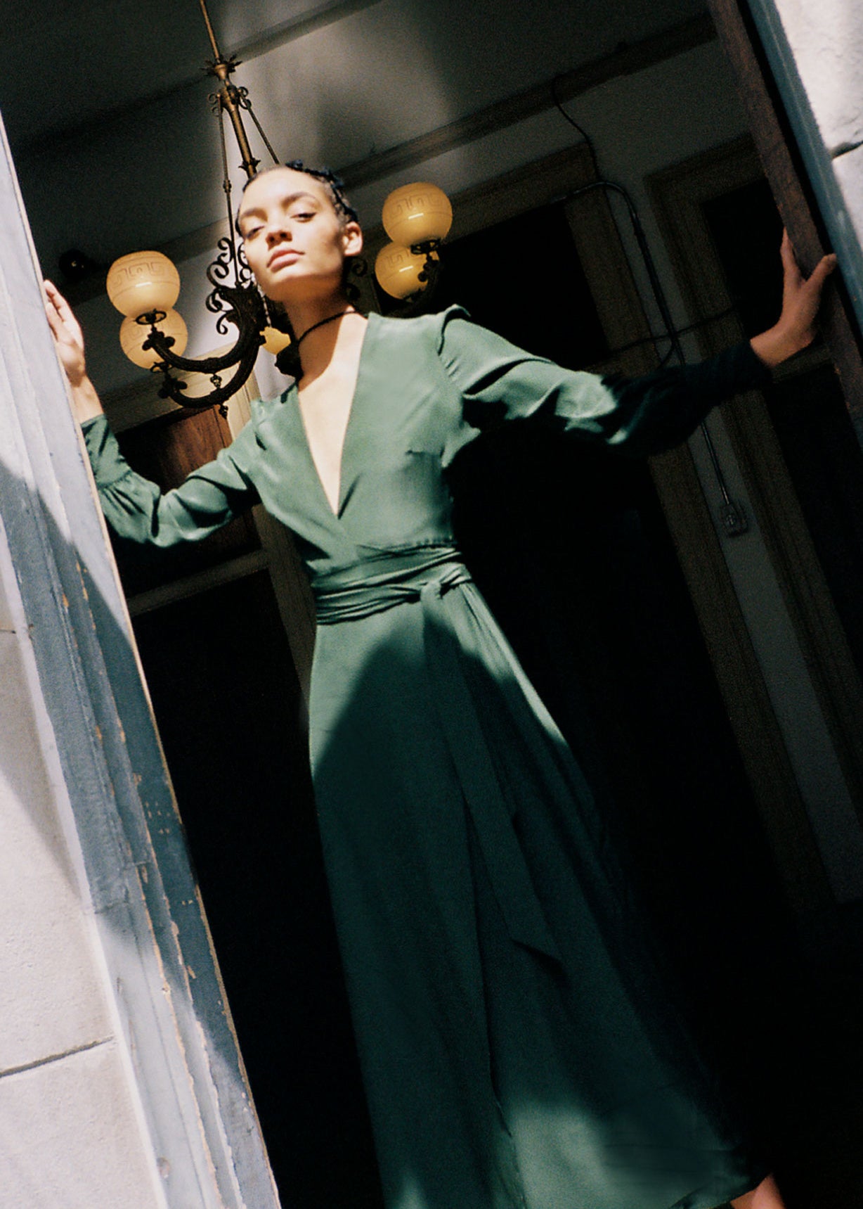 Editorial image of the dark green matte silk charmeuse Kamperett Adelaide Midi Dress.