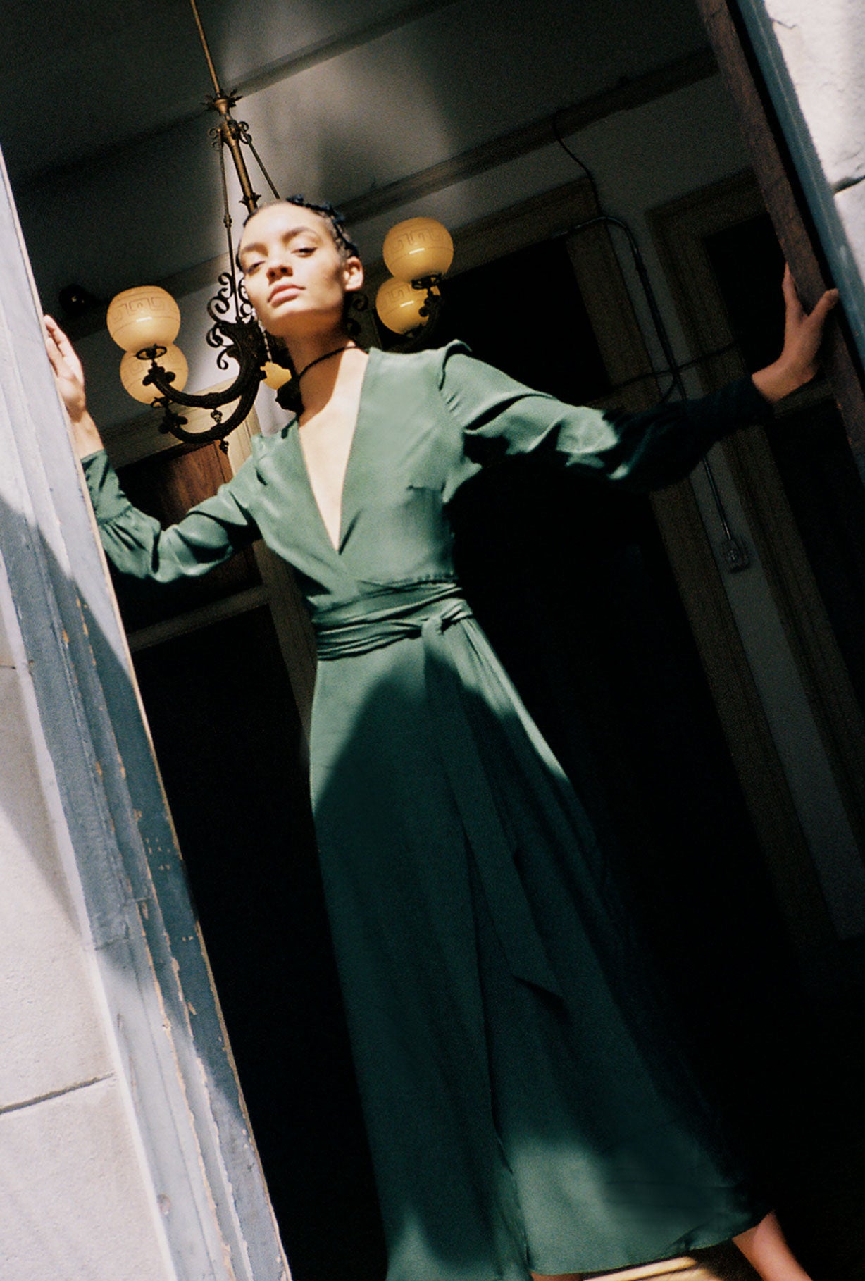 Editorial image of the dark green matte silk charmeuse Kamperett Adelaide Midi Dress.