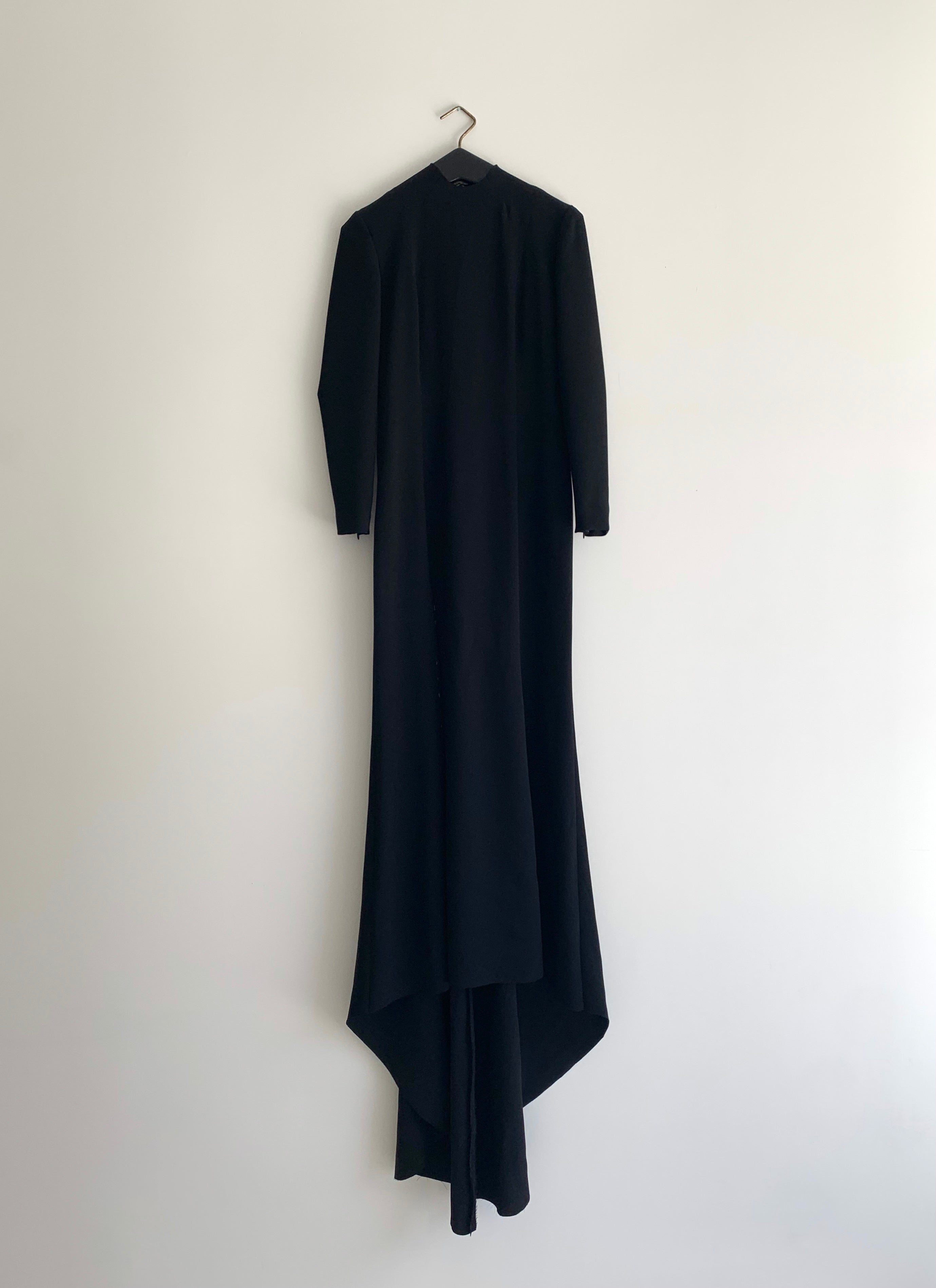 Editorial image of the black acetate crepe Kamperett Arc Gown.
