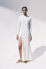 Full-length view of the Kamperett Arc Gown in Ivory silk crepe, featuring a minimalist mock neck, long tapered sleeves, and a sculptural side leg slit.