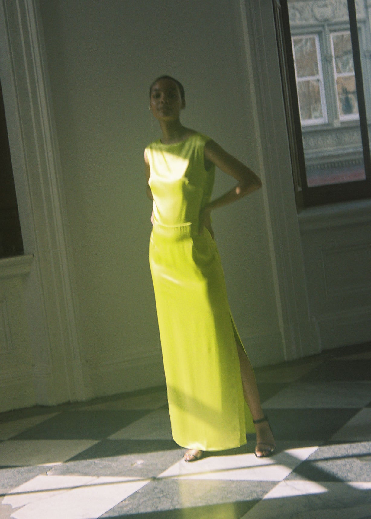 Editorial image of the chartreuse silk charmeuse Kamperett Lockwood Gown.
