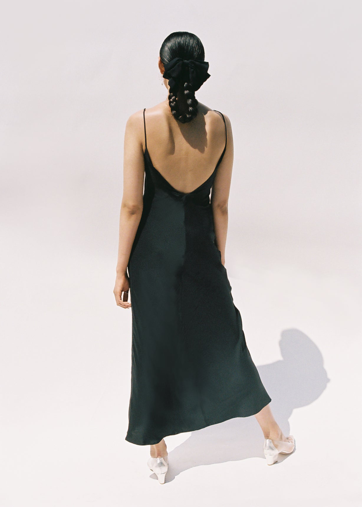Editorial image of the black matte silk charmeuse Kamperett Long Slip.