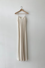 Front view of the ivory matte silk charmeuse Kamperett Long Slip with straight-cut neckline and fixed spaghetti straps.