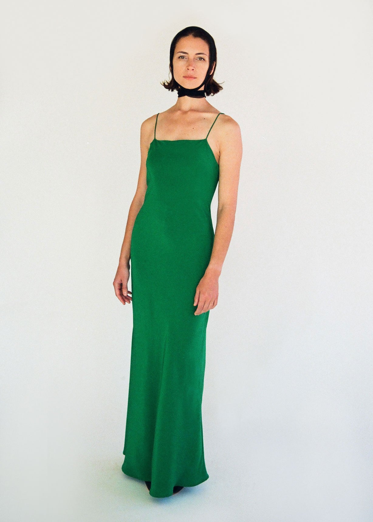 Back view of the kelly green matte silk charmeuse Kamperett Long Slip showing the deep V back.