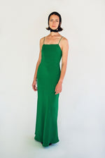 Back view of the kelly green matte silk charmeuse Kamperett Long Slip showing the deep V back.
