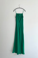 Editorial image of the kelly green matte silk charmeuse Kamperett Long Slip.