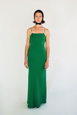 Side view of the kelly green matte silk charmeuse Kamperett Long Slip showing the bias-cut drape.
