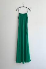 Detail of the kelly green matte silk charmeuse Kamperett Long Slip with fixed spaghetti straps.