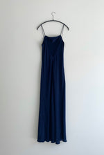 Back view of the navy matte silk charmeuse Kamperett Long Slip showing the deep V back.