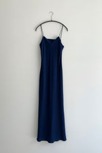 Front view of the navy matte silk charmeuse Kamperett Long Slip, a bias-cut maxi with straight neckline.
