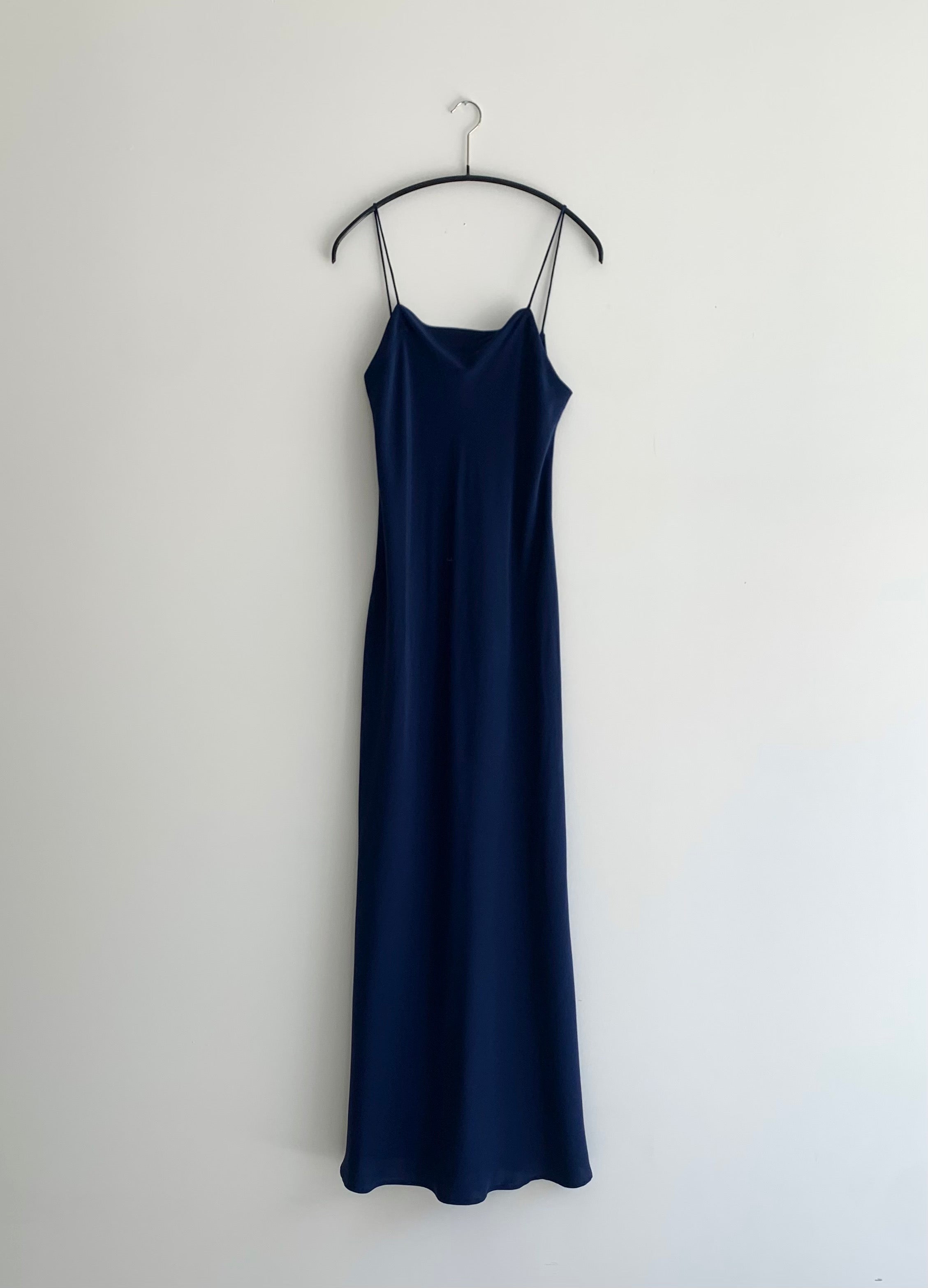 Front view of the navy matte silk charmeuse Kamperett Long Slip, a bias-cut maxi with straight neckline.