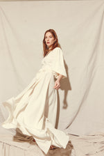 Editorial image of the alabaster four-ply silk crepe Kamperett Loretta wedding gown.