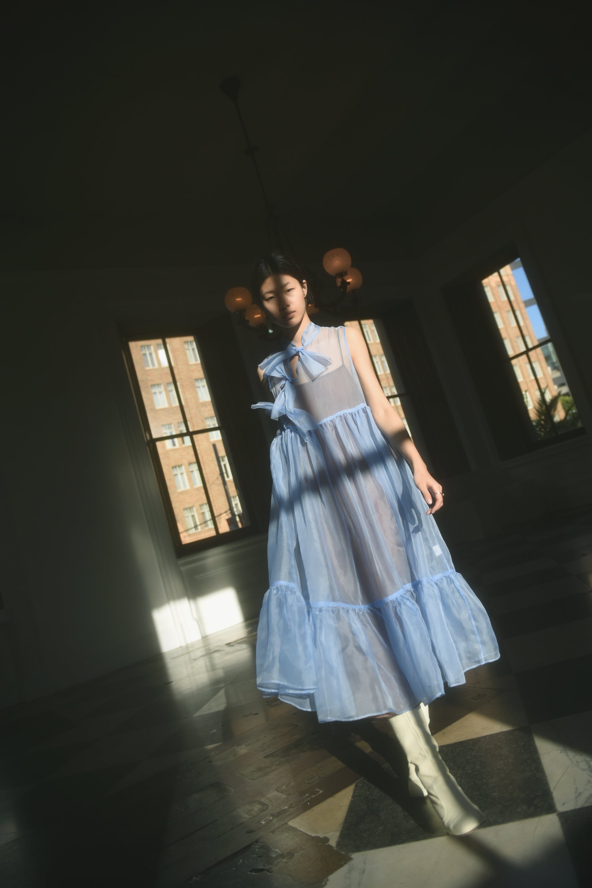 Angled view of the cornflower silk organza Kamperett Mae Dress.