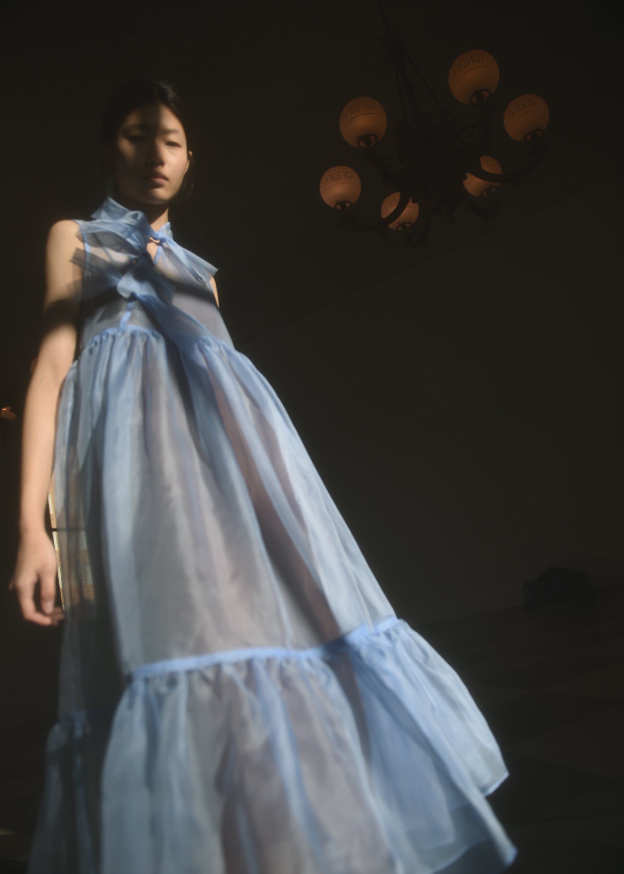 Back view of the cornflower silk organza Kamperett Mae Dress with empire waist seaming.