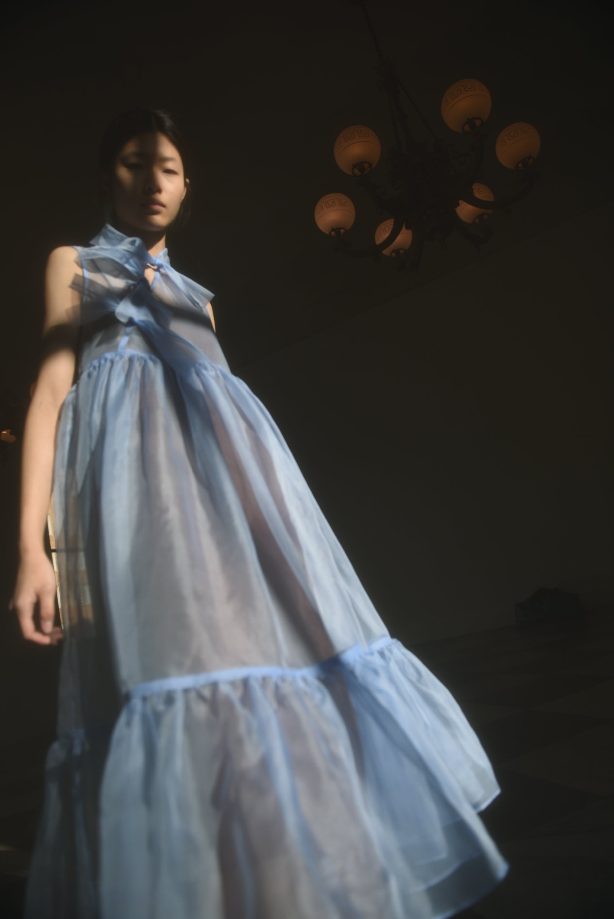 Back view of the cornflower silk organza Kamperett Mae Dress with empire waist seaming.