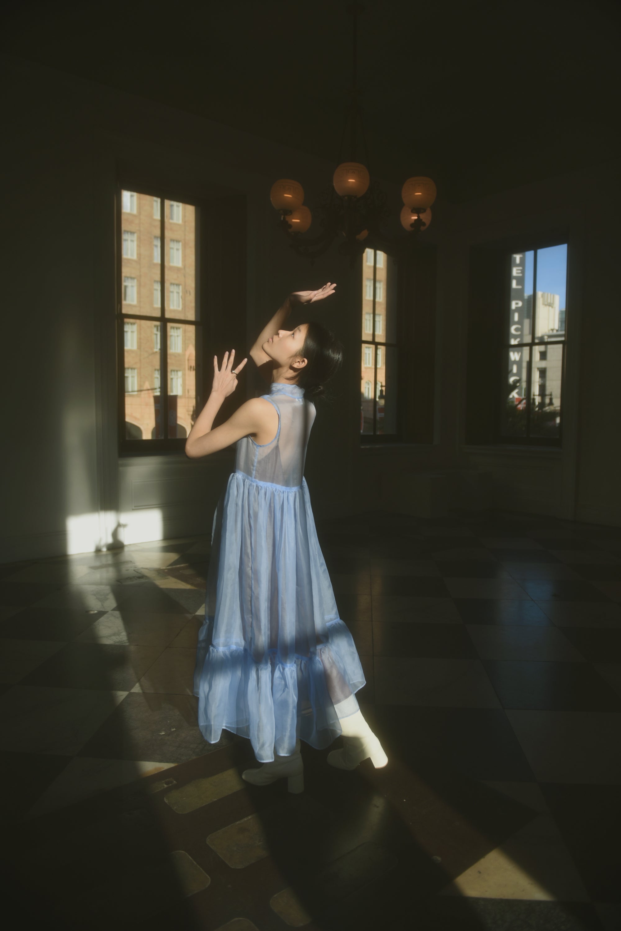 Editorial image of the cornflower silk organza Kamperett Mae Dress.