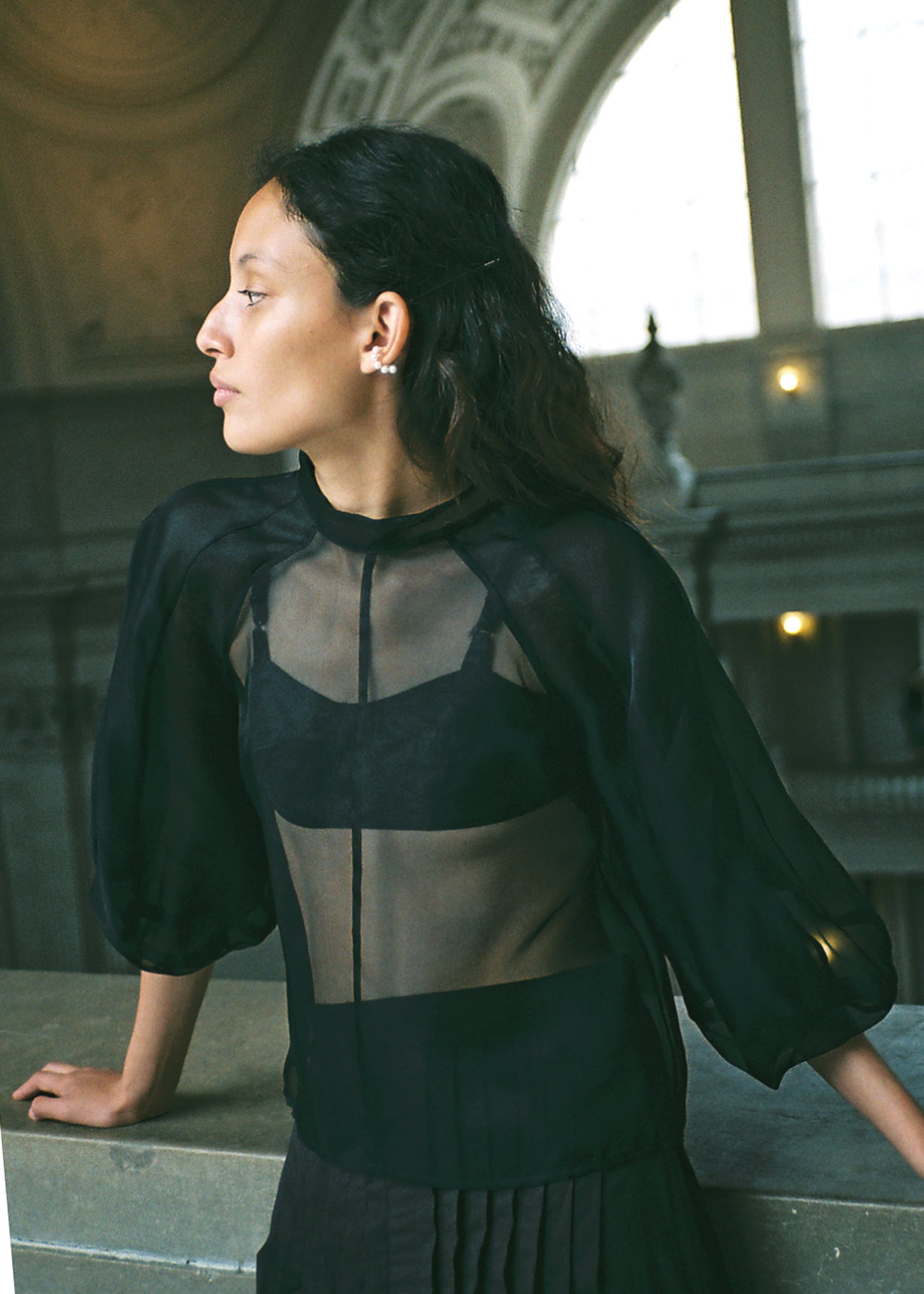 Editorial image of the ivory silk organza Kamperett Meiere Blouse with architectural sleeves.