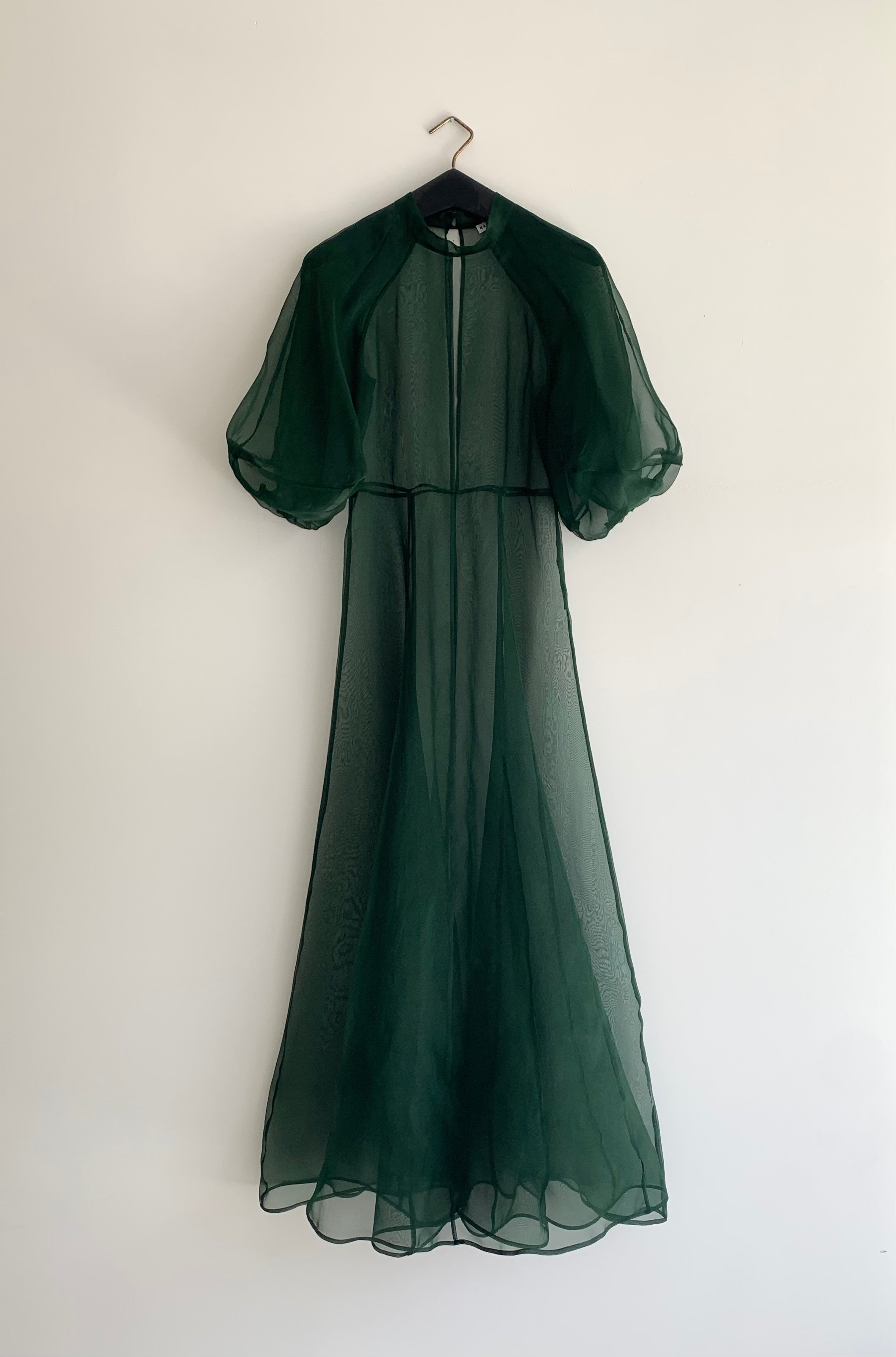 Editorial image of the dark green silk organza Kamperett Meiere Gown.