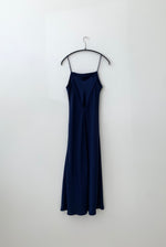 Back view of the navy silk charmeuse Kamperett Midi Slip showing the deep V back.