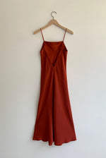 Back view of the rust sueded silk charmeuse Kamperett Midi Slip showing the deep V back.