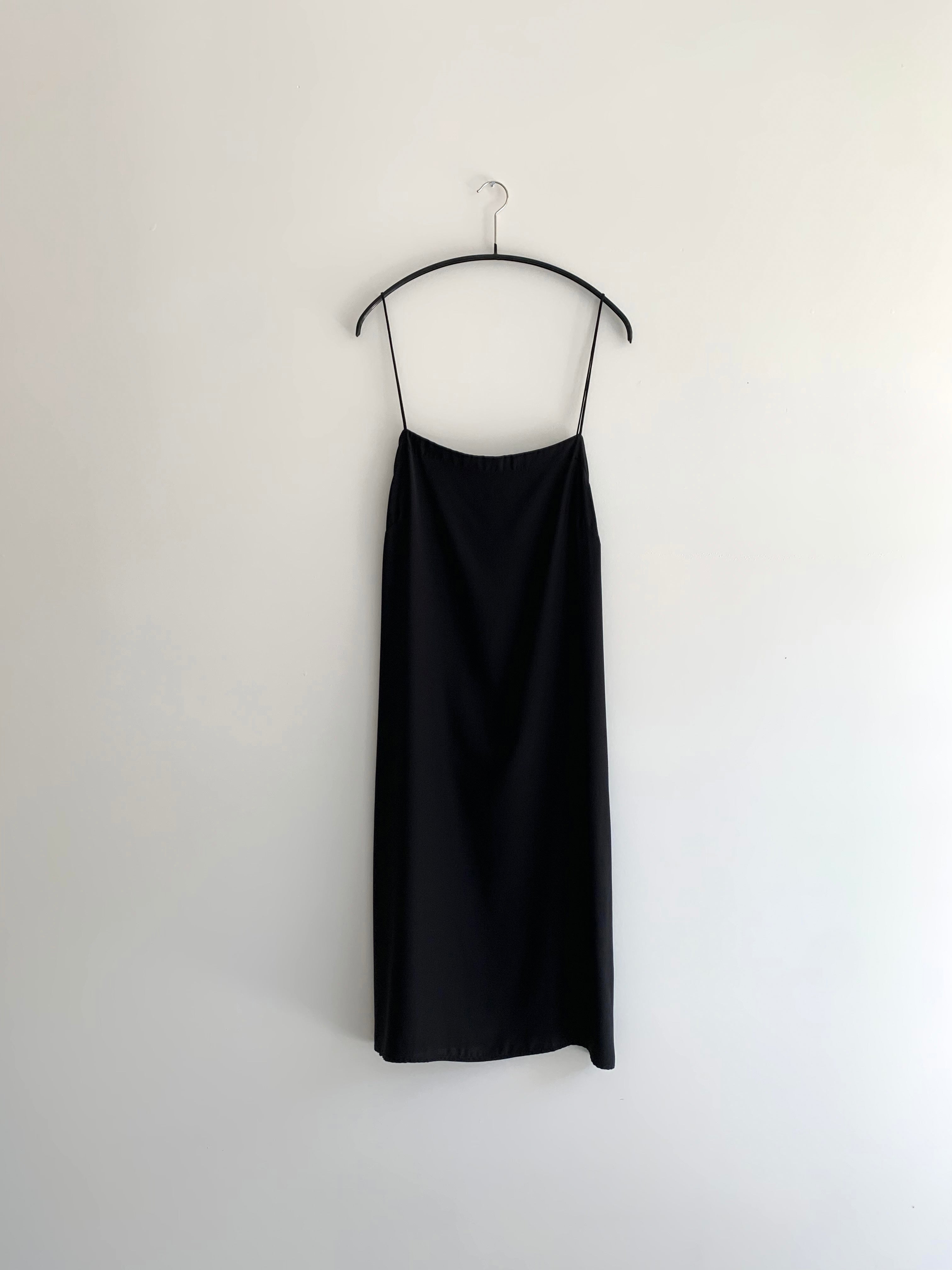 Flat image of the black sueded silk charmeuse Kamperett Short Slip.