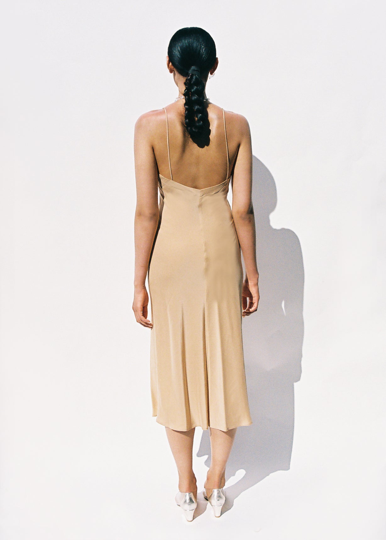 Alternate editorial of the buff silk Kamperett V-Neck Midi Slip.