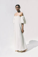 Editorial film image of the alabaster silk crepe Kamperett Verona Gown.