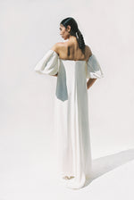 Editorial side view of the alabaster silk crepe Kamperett Verona Gown.